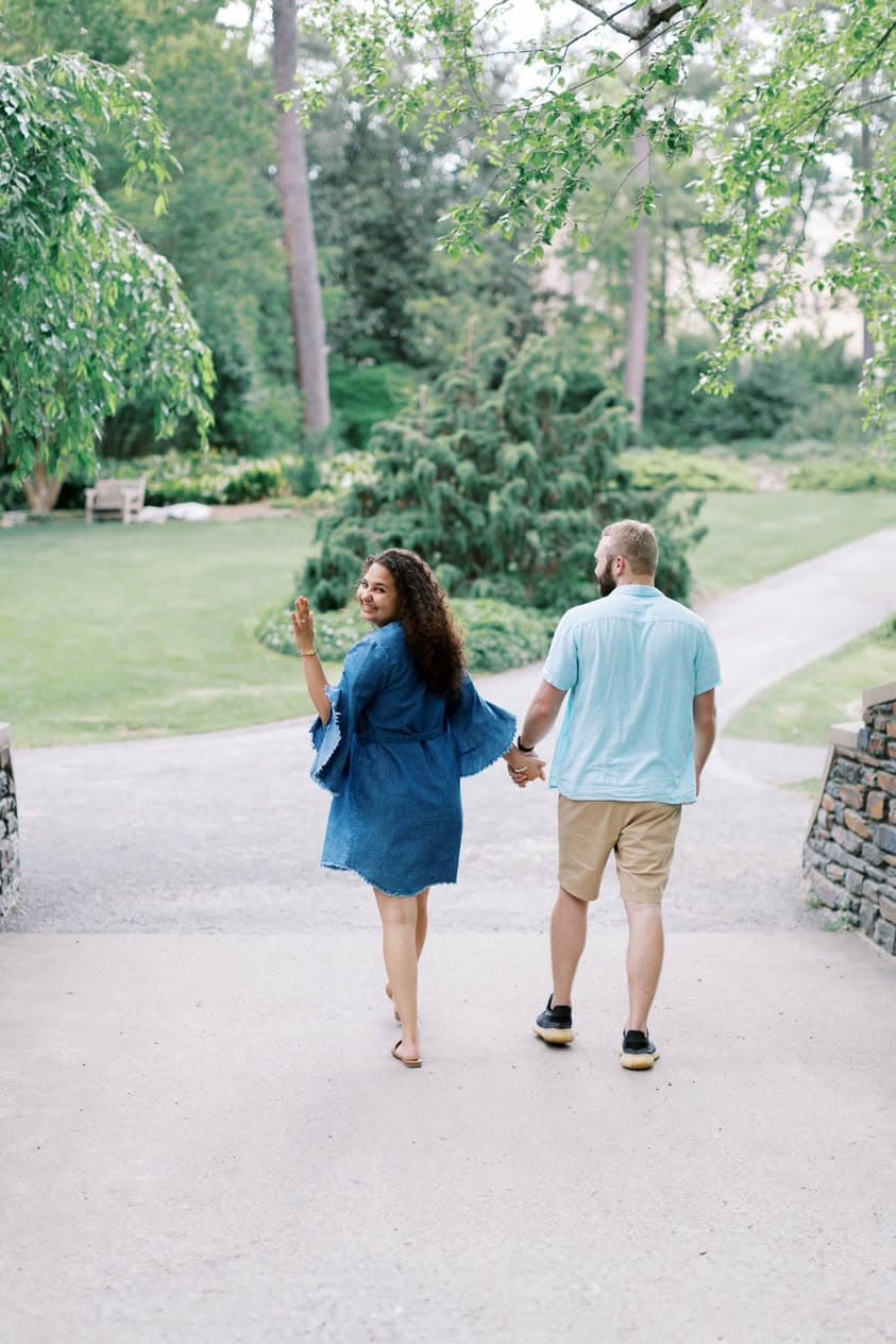 Cole Hardison and Emily Lowery smiling during their engagement session